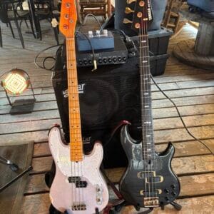 Two bass guitars and amp.
