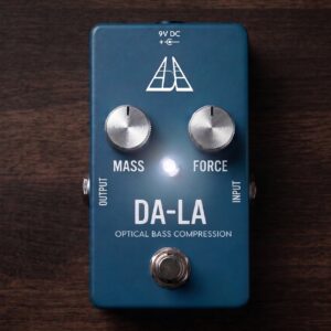Home Blue DA-LA Optical Bass Compression pedal with silver Mass and Force knobs, an illuminated LED, and a footswitch